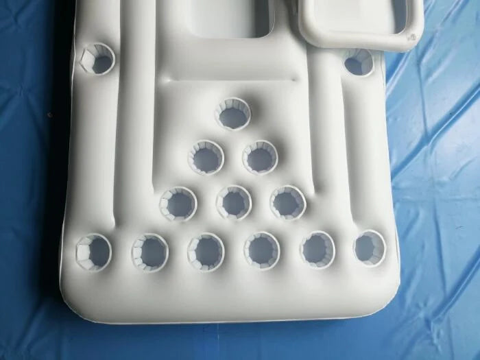 White inflatable beer pong table with built-in cooler floating in pool