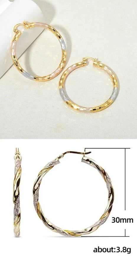 Gold geometric alloy earrings with ring detail, perfect for modern styling