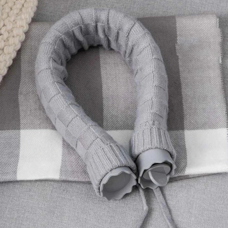 Cozy silicone hot water bottle with knitted cover, providing warmth and relaxation for neck, shoulders, and head