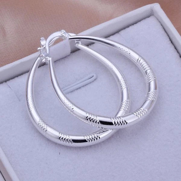 Silver-plated copper hoop earrings with 925 silver treatment, 3.9cm by 3.2cm
