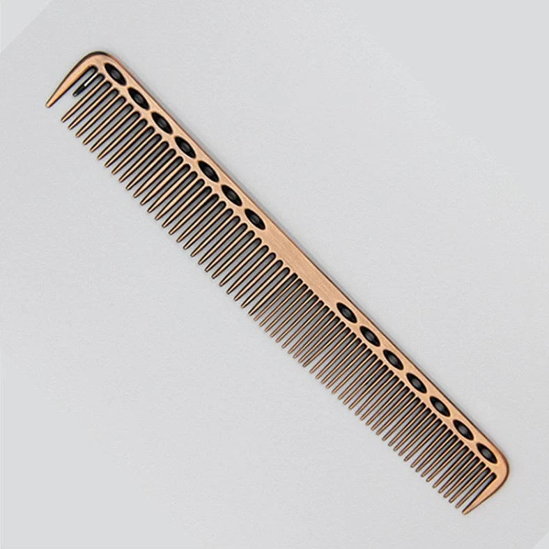 Space aluminium haircut comb in rose gold finish showing precise tooth spacing and polished metal surface