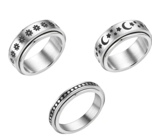 Titanium steel ring with rotating stars and moon design in various colors and sizes