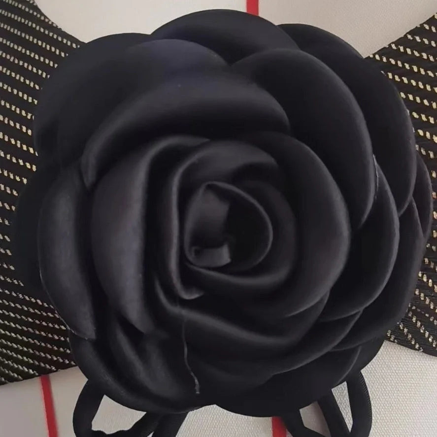 Black women's triangle swimsuit with adjustable ties and lined construction for swimming