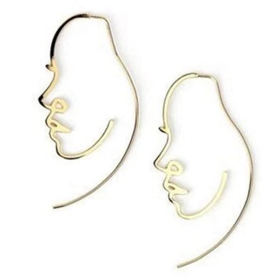 Abstract face contour earrings in gold and silver, 75mm x 35mm