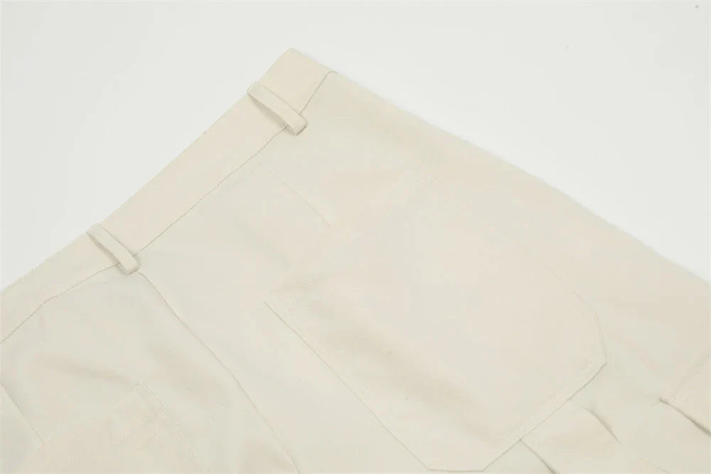 Stylish black overalls with pleated pockets, designed for the active Kiwi lifestyle