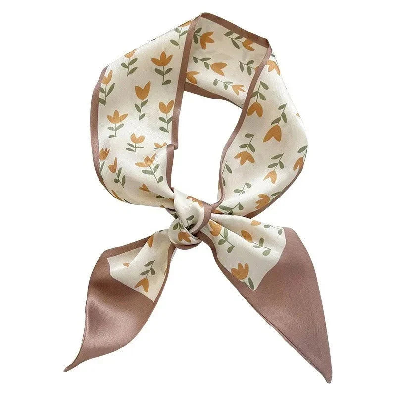 A high-quality silk scarf hair band in a versatile khaki nude color, perfect for adding elegance to any Kiwi outfit.