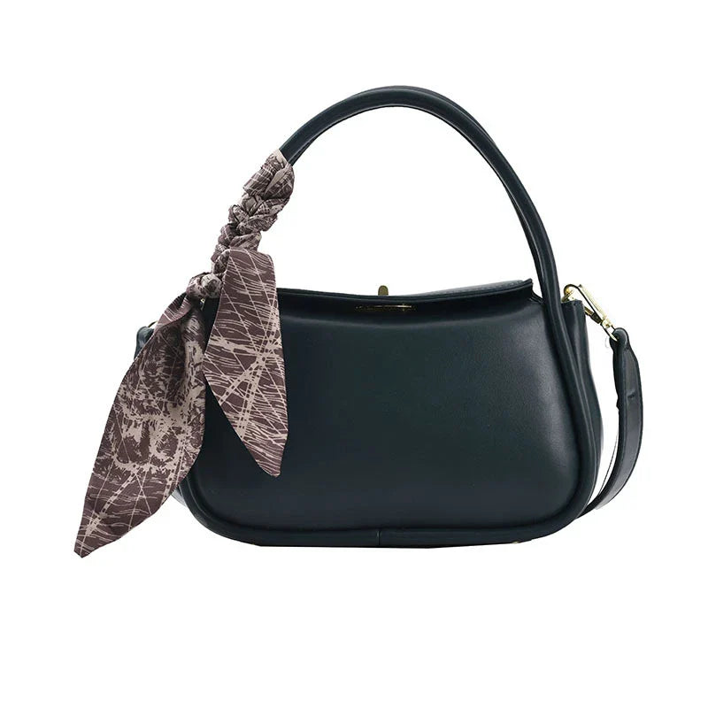 Premium silk scarf handbag in a variety of Kiwi-approved colours, featuring a magnetic buckle closure and oval shape for ample storage.