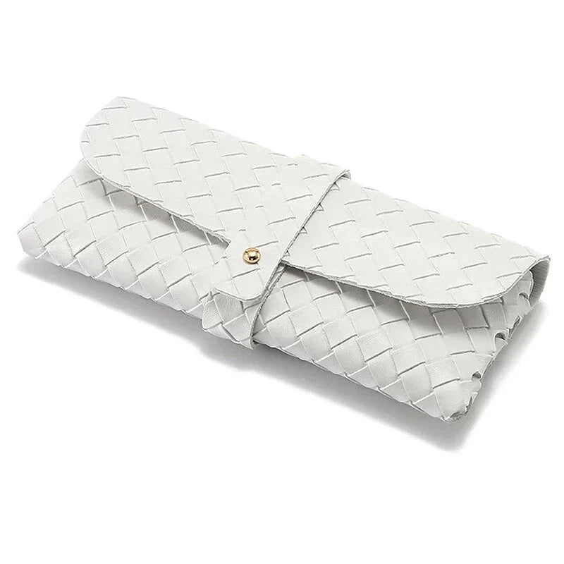 Stylish black and white twist braided leather sunglasses case with snap closure, protecting eyewear in a fashionable way