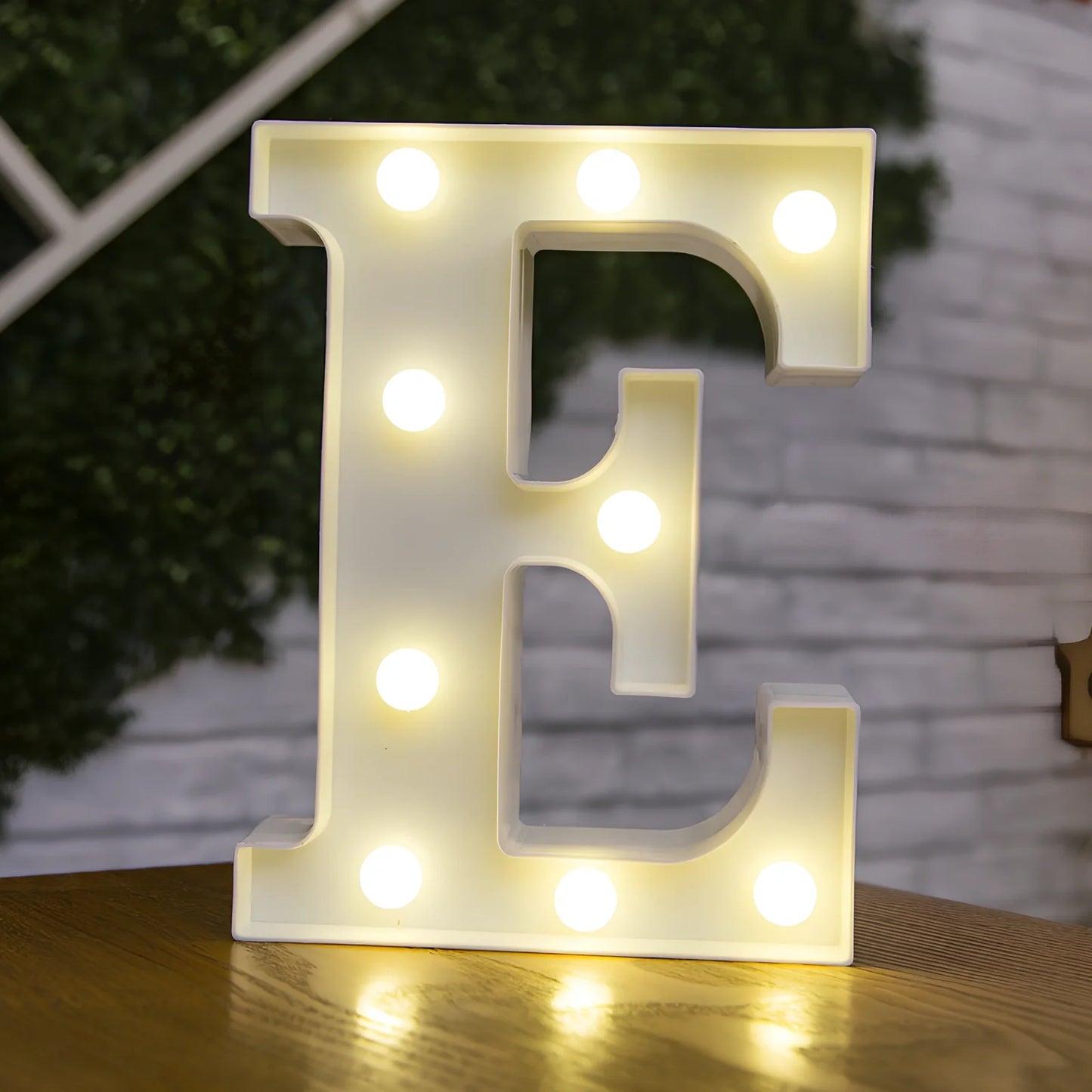 White plastic LED alphabet marquee sign with warm white illumination, 22cm height with battery operation