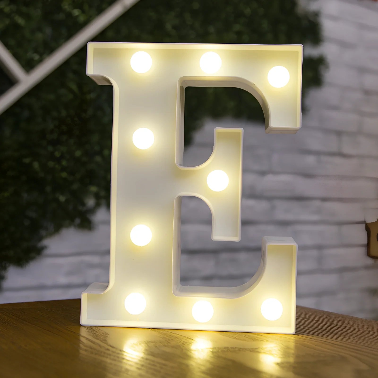 White plastic LED alphabet marquee sign with warm white illumination, 22cm height with battery operation