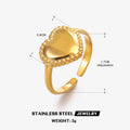 Adjustable stainless steel heart ring with electroplated gold finish on plain background