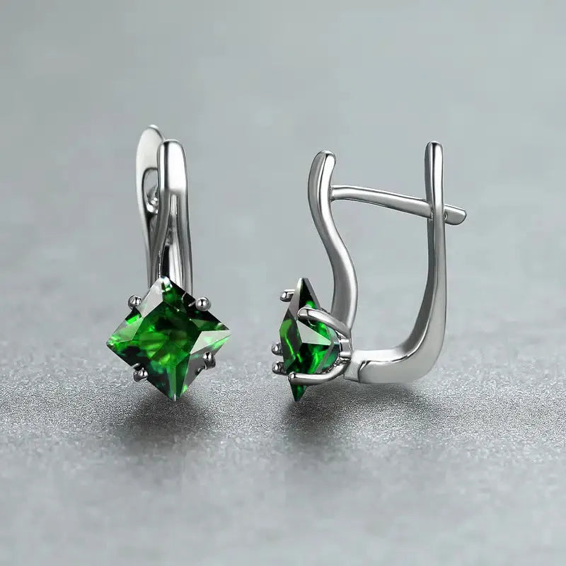 A pair of women's copper earrings with a diamond design made from inlaid zircon stones.
