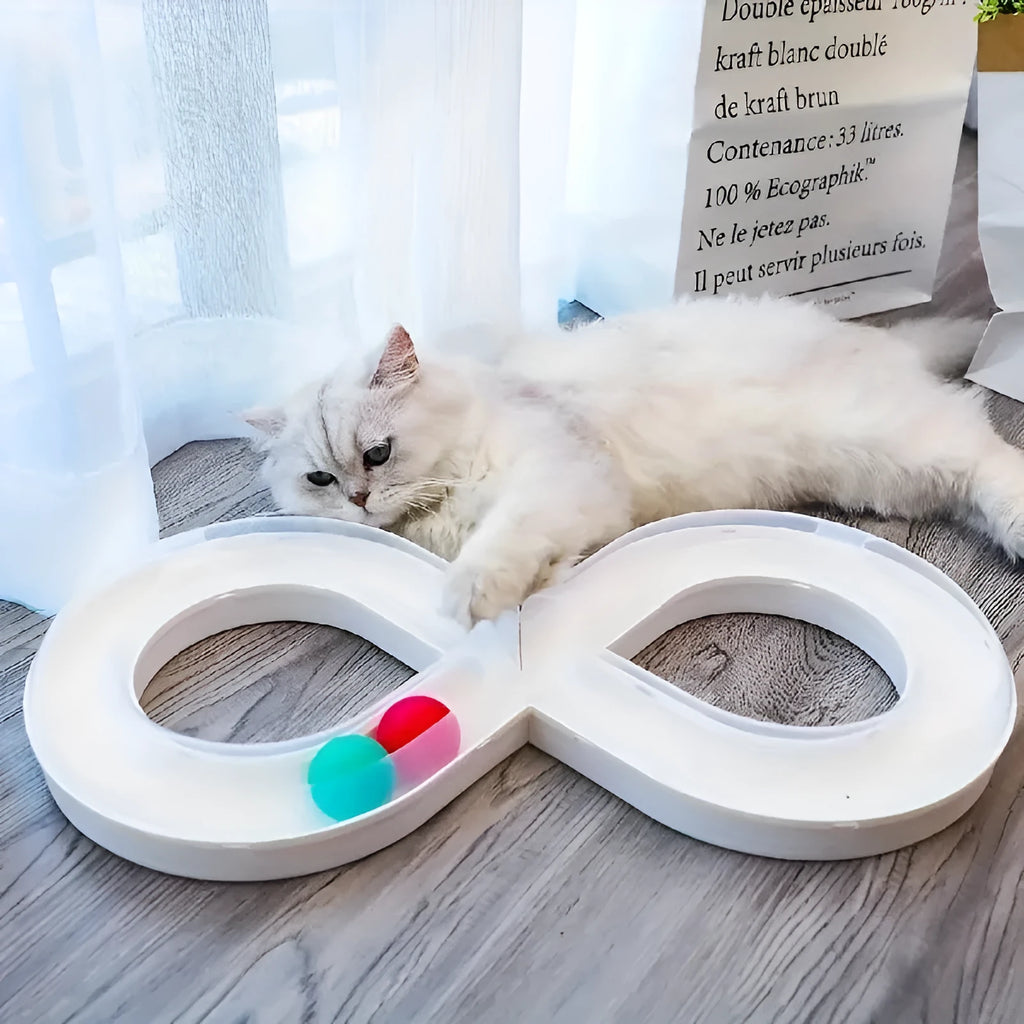 Blue interactive cat play track with turntable ball and four toy attachments on a white background.