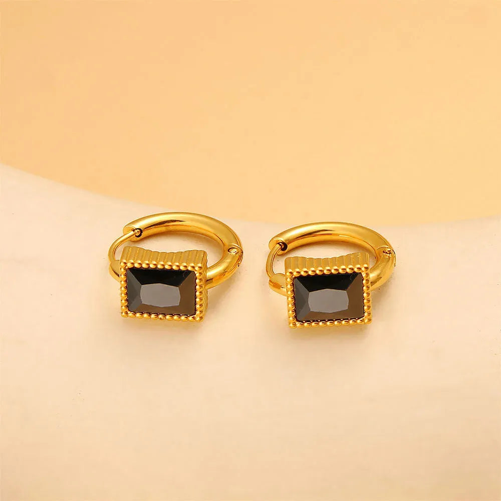 Square geometric stainless steel earrings with round rings and zircon accents, shown in white, black, and green colour options.