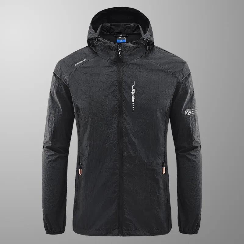 Man wearing a lightweight grey hooded nylon jacket for summer sun protection