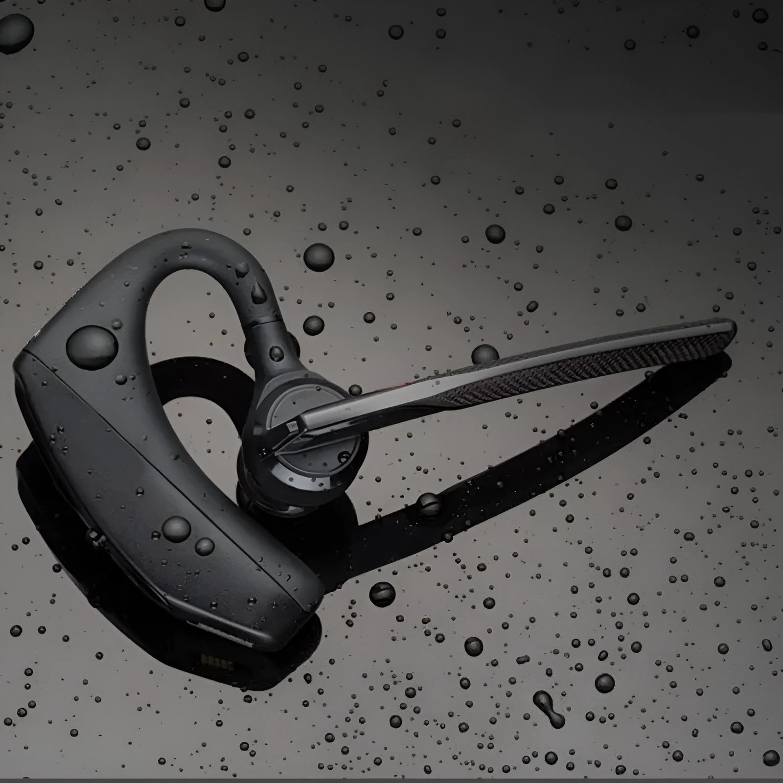Black Bluetooth sports headphones with USB charging port and battery display on a white background.