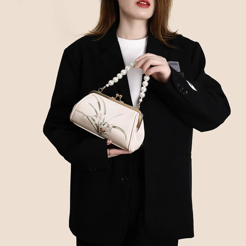 Beige soft PU leather women's shoulder bag with embroidery detail and shell shape design