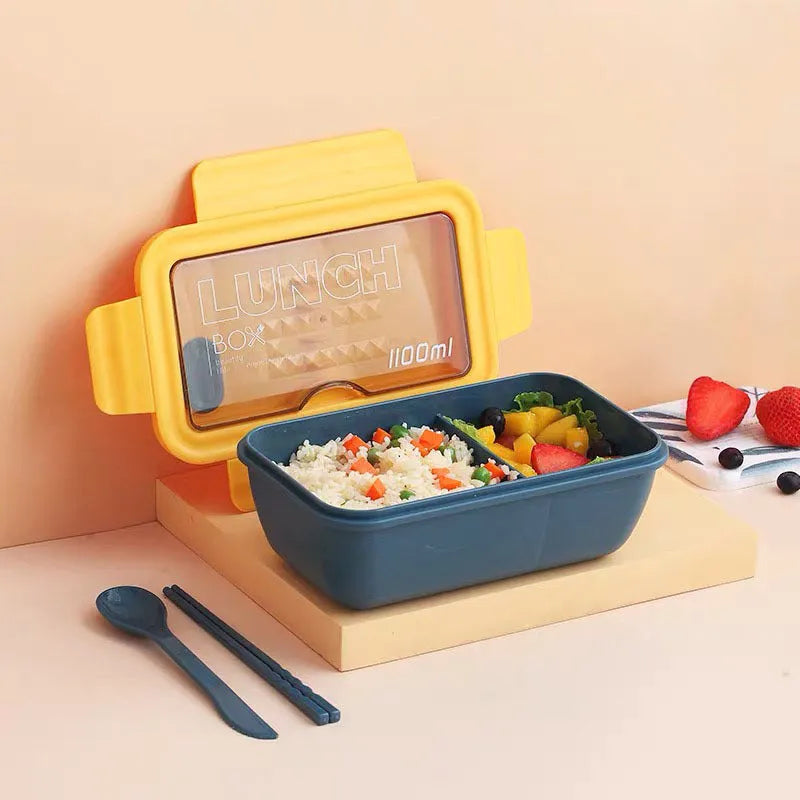 Green four-layer partitioned bento lunch box showing separate food compartments
