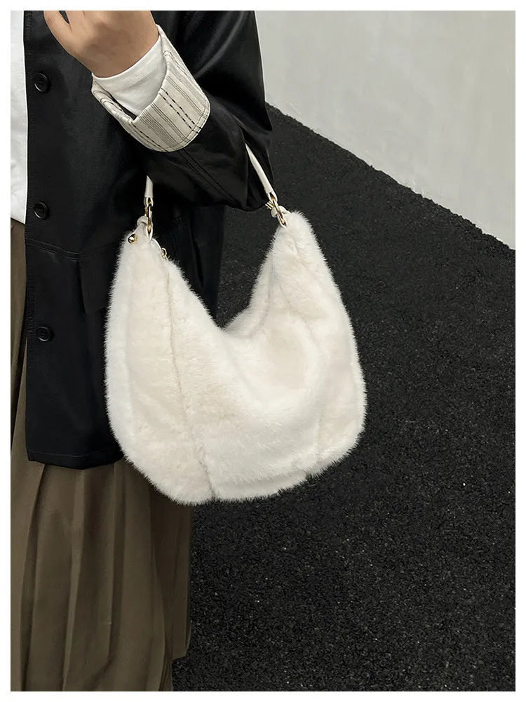 Beige one shoulder underarm bag in plush with splicing details, horizontal square shape, and single strap