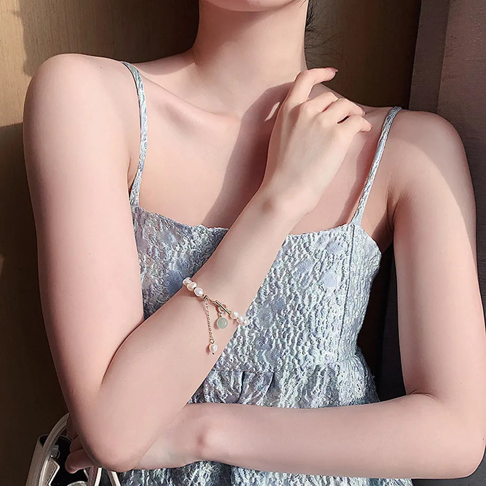Women's irregular freshwater pearl adjustable bracelet on a plain background showing the alloy clasp and irregular pearl beads