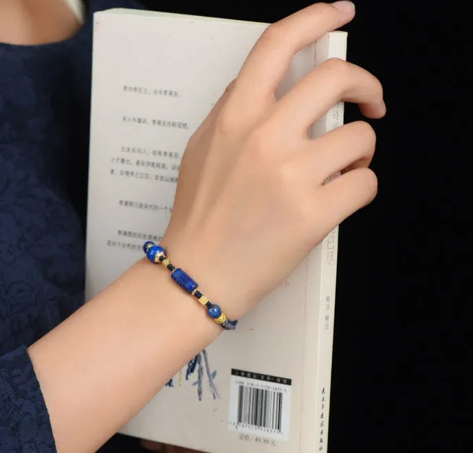 Close-up of a hand-woven flexible wire watch band in Lapis Lazuli blue colour.