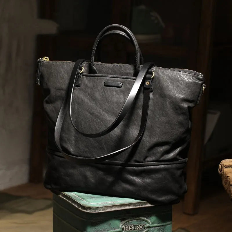 Black handmade vegetable tanned cowhide tote bag with zipper closure and 15-inch computer slot for daily outdoor use