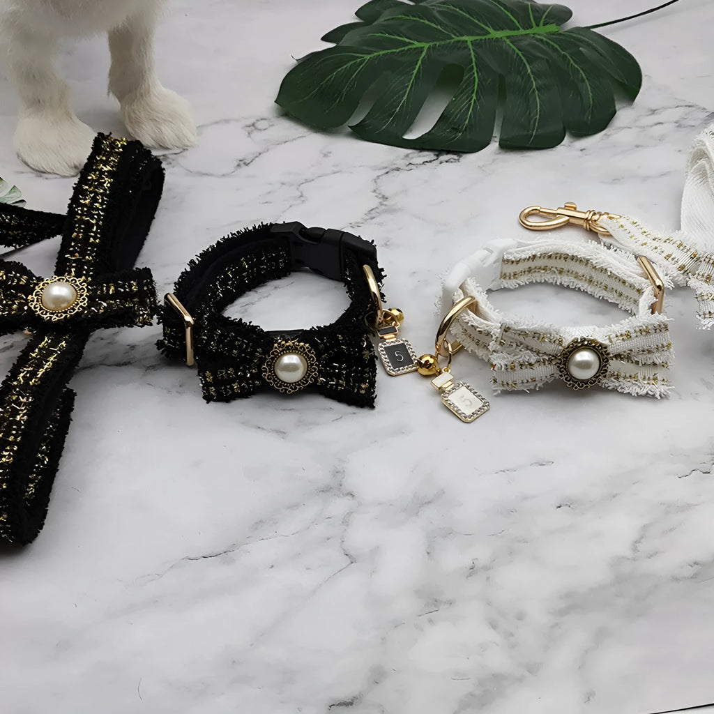 Black and white nylon striped dog collar and leash set on a wooden floor showing size labels S M L