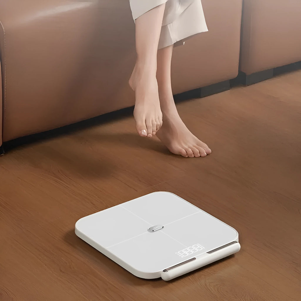 White professional body fat scale with 8 electrodes, tempered glass platform, and LED display.