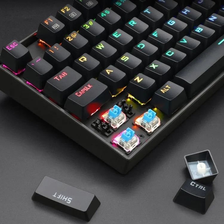 Monochrome luminous wired mechanical gaming keyboard set with green axis switches, aluminium alloy frame, black finish, includes mouse, mouse pad, and headphones