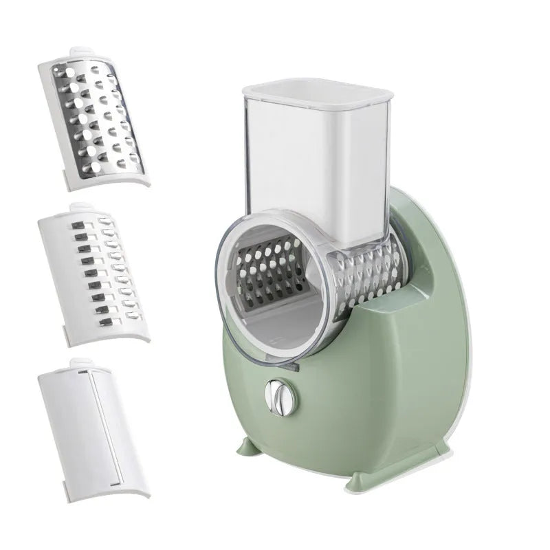 White electric vegetable slicer with rotary grater, feeding port, and three cutting blade pairs on kitchen counter