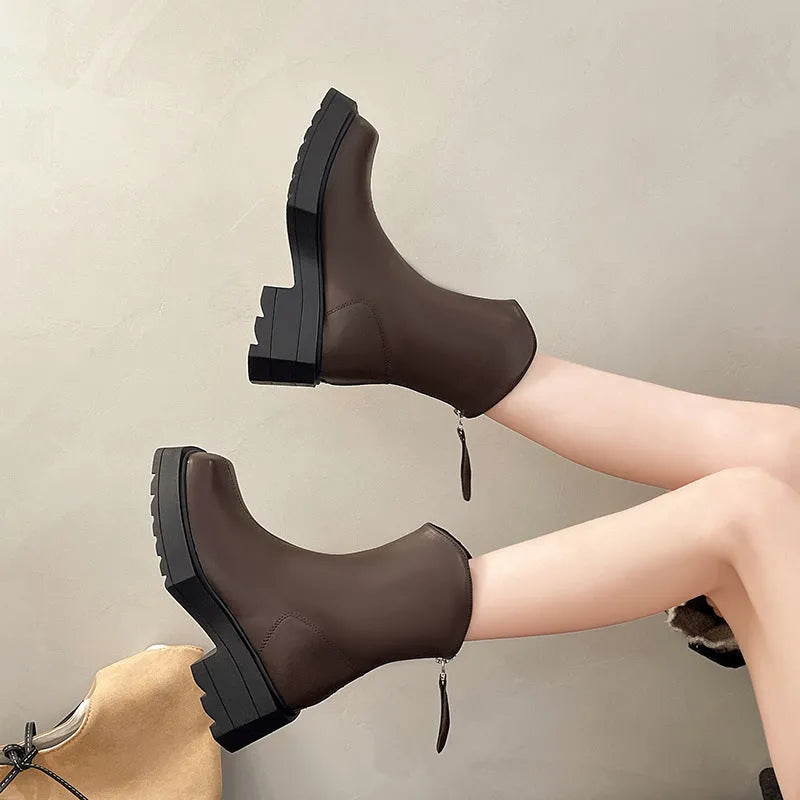 Women's black platform Martin boots with square toe and back zipper, showing 6-8cm heel