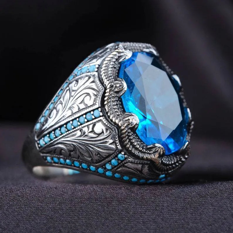 Antique silver geometric couple ring with blue zircon stone centrepiece showing European and American styling