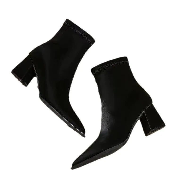 Women's khaki pointed-toe ankle boots with a wedge heel on a rubber sole.