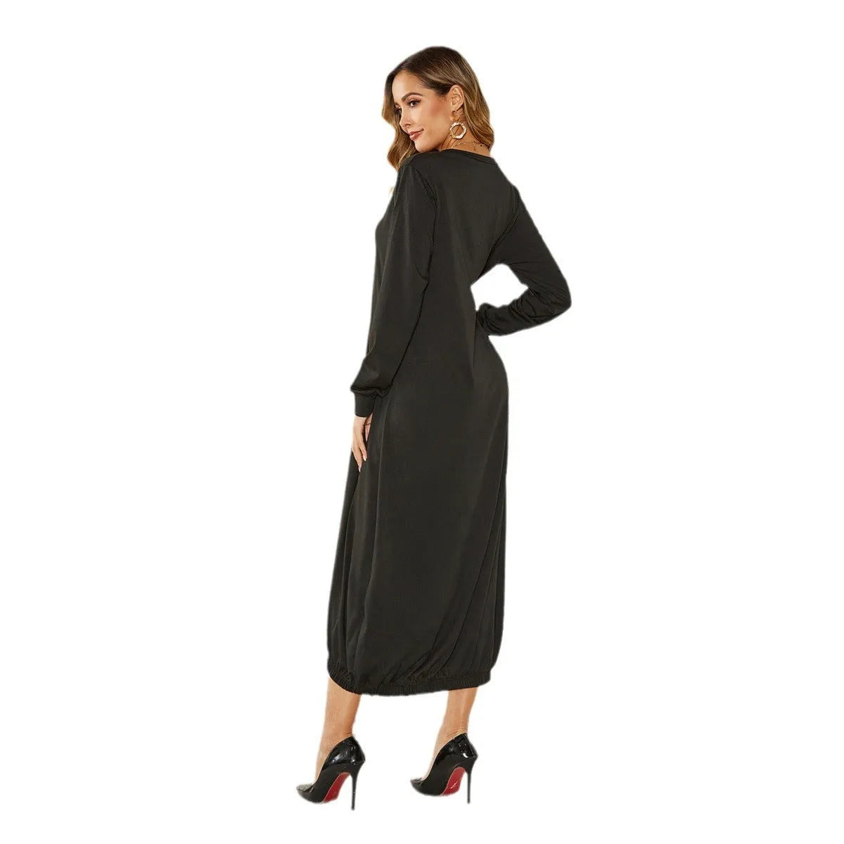 A loose, black lantern-style dress with a lace-up detail on the crew neckline.