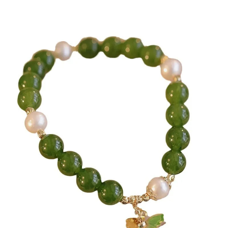 Natural green chalcedony gemstone bracelet with round beads in a minority design style for women.