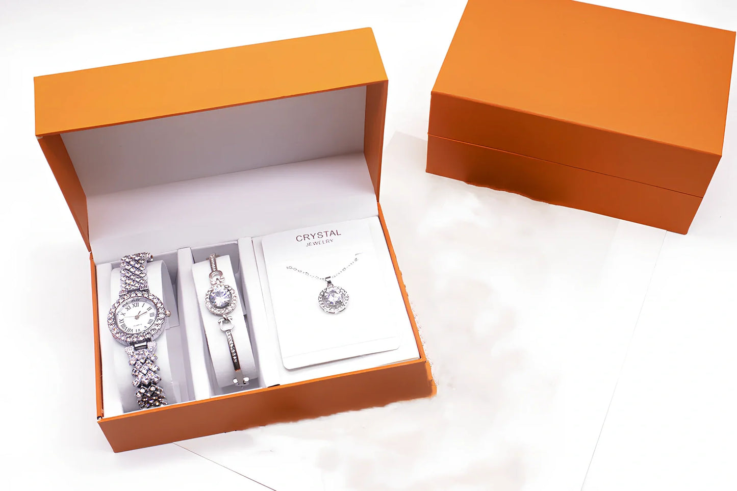 3-piece rhinestone quartz watch set with 22.5cm gold alloy strap, bracelet, and necklace on display