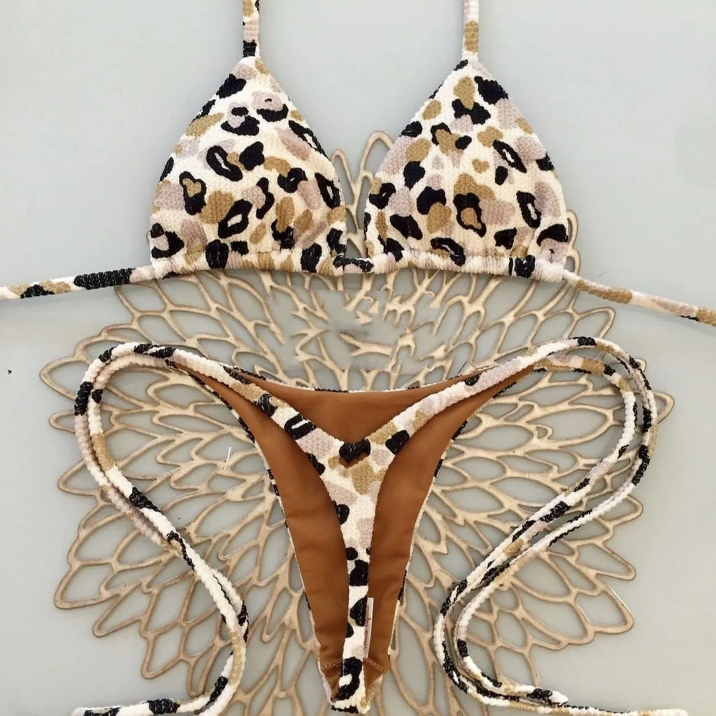 Women's printed bikini swimsuit with briefs style on a mannequin, showing the cotton lining and high elasticity fabric.