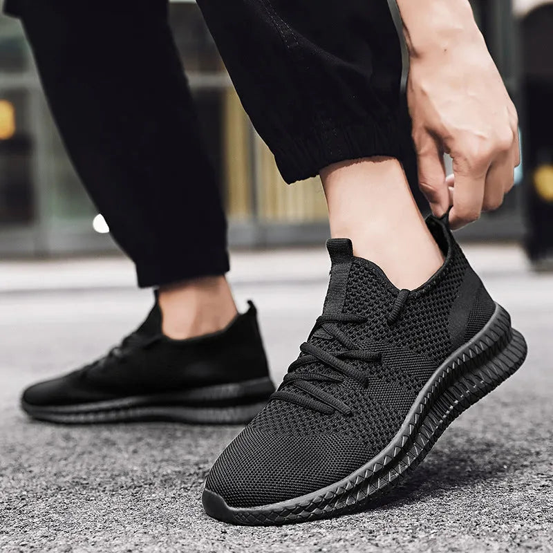 Men's non slip walking sneakers with breathable mesh upper, lace-up closure, and EVA sole in black