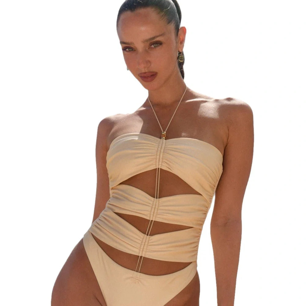 Women's black pleated one-piece swimsuit with lace-up front closure and sleeveless design