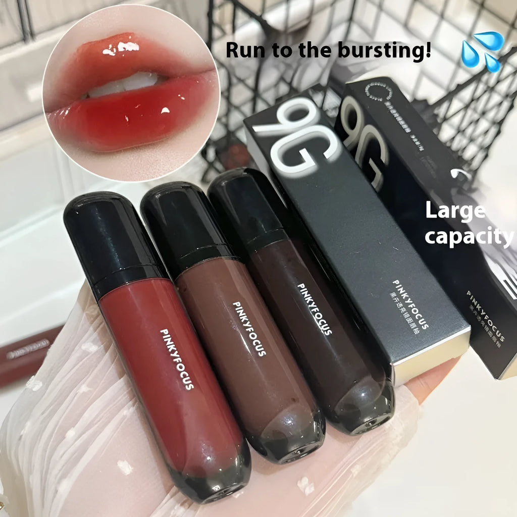 Mirror Lip Lacquer in glossy black finish showing six colour shades from tomato red to sweet potato purple