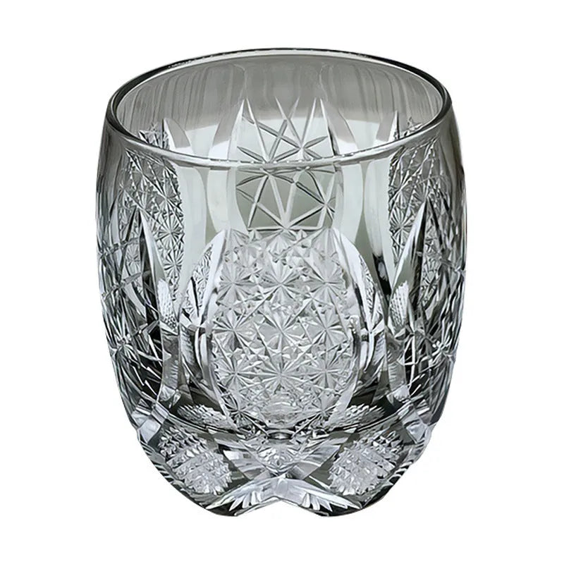 Four Japanese-style Edo crystal glass whisky tumblers in amber and clear cut-glass designs placed in wooden box
