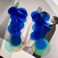 Gradient blue hand-woven long fringe earrings with artificial crystal and sterling silver needle on white background