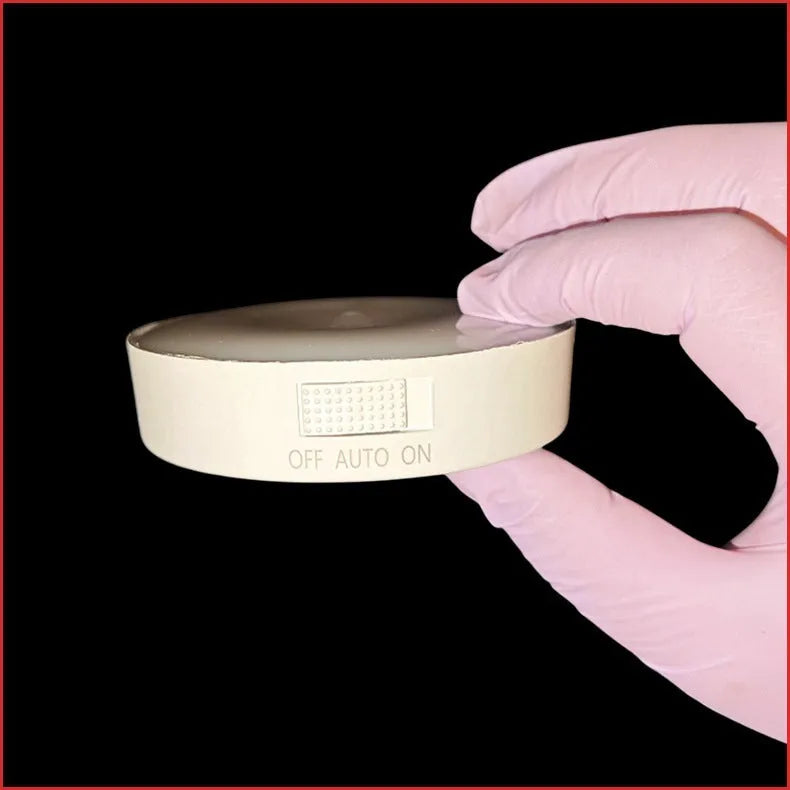 Round small night lamp with side push key, 86mm diameter, white housing, glowing warm light on a wooden nightstand