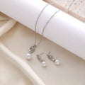 Pearl pendant necklace and earrings set on display: electroplated alloy, hemp flowers chain, silver colour.