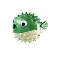 Green TPR fish-shaped dog toy with textured surface for treat dispensing and teeth cleaning