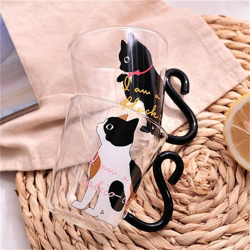 Adorable cat-themed glass mug with tail-shaped handle, perfect for hot and cold beverages