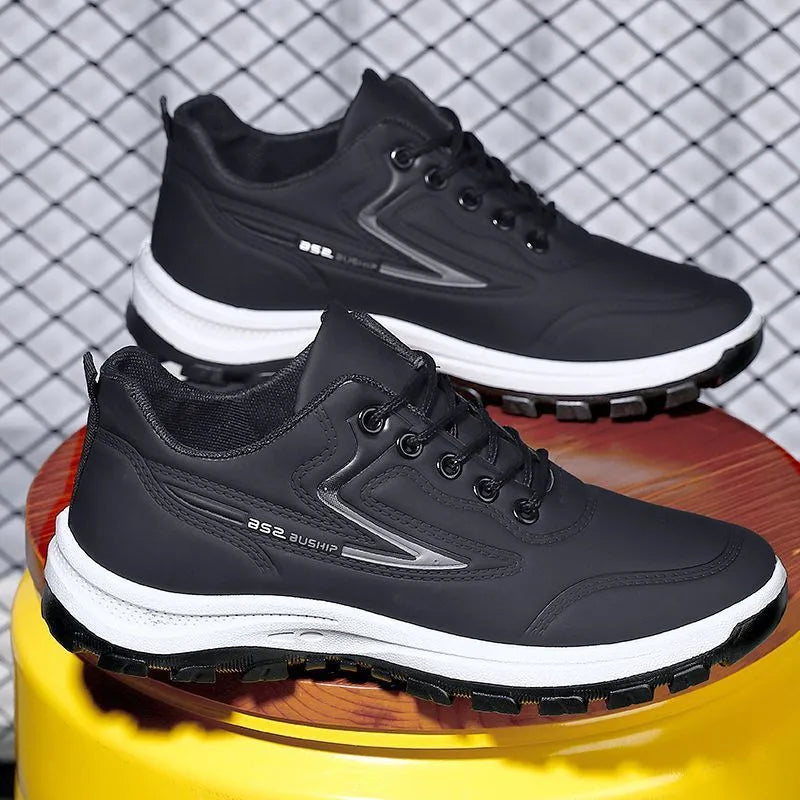 Waterproof leisure sports shoes in black and grey colour with artificial PU upper and plastic sole