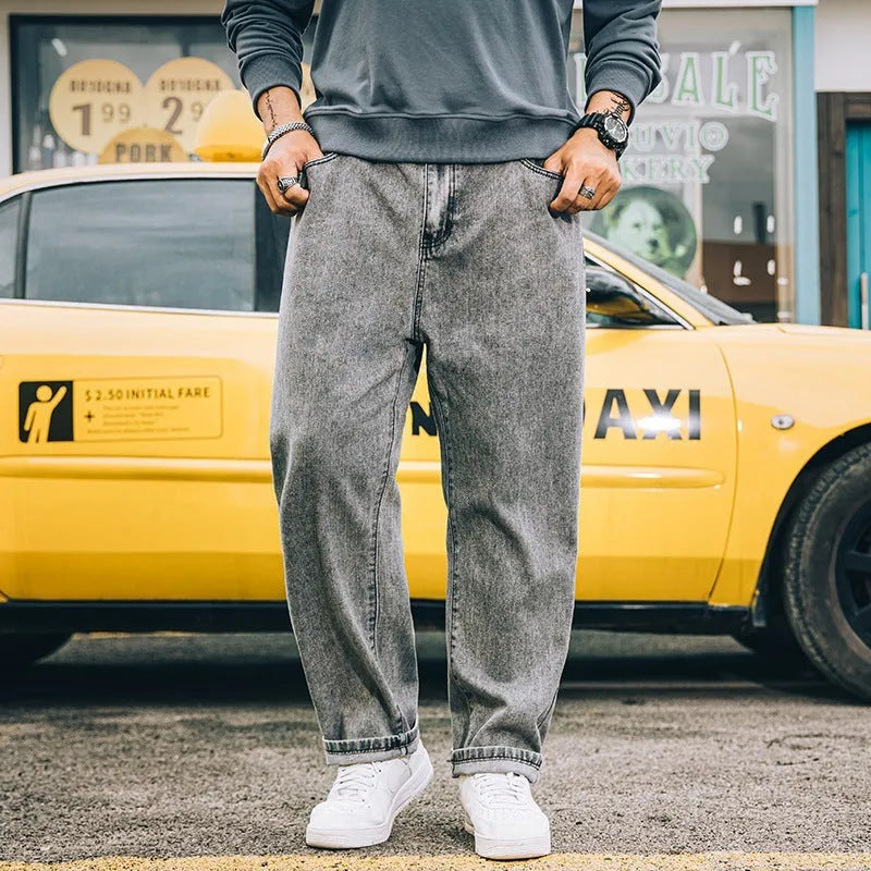Men's loose straight jeans in dark blue, light blue and grey colours showing simple casual style