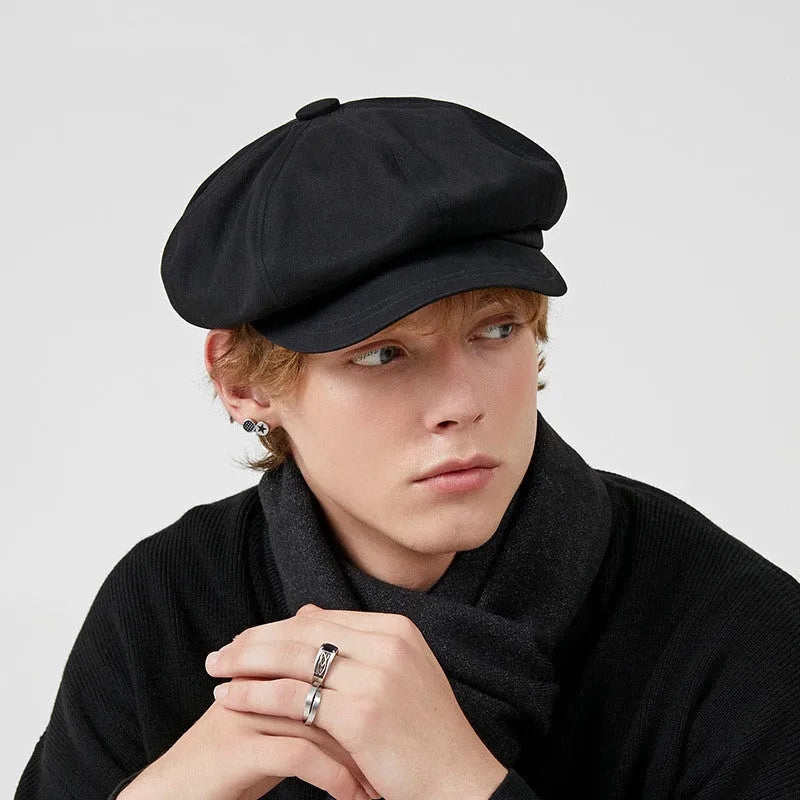 Cotton newsboy cap in black, octagonal dome crown, side view showing structure