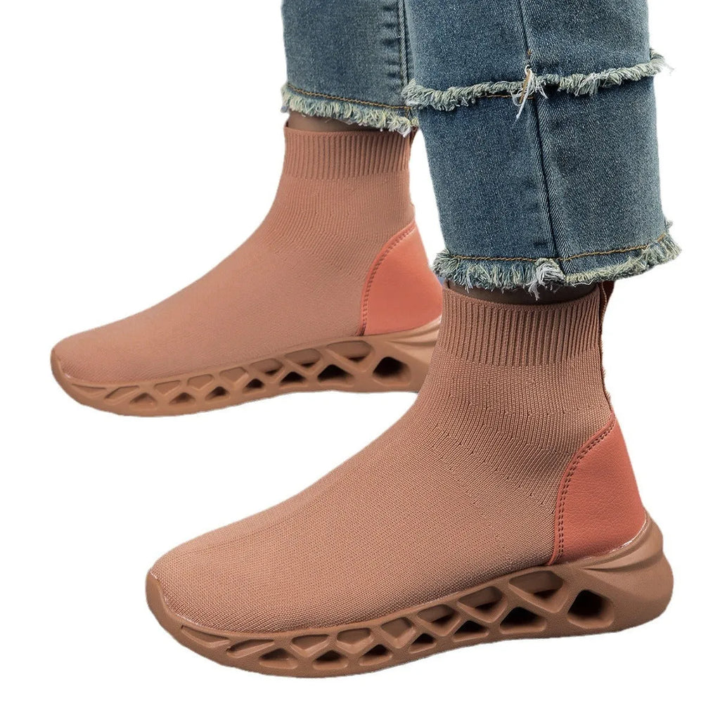 Women's terracotta coloured stretch mesh socks boots with flat heel and round toe on a white background.